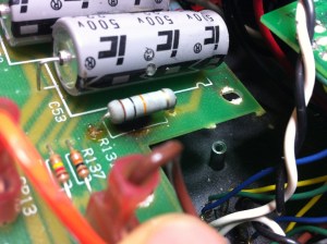 The problem was one of intermittent volume drop out. If you bang on the amp with your fist it would come back to full volume for a bit but definitely not reliable. Power supply dropping resistor has burnt PCB underneath it.