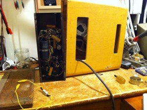 ou can pull the chassis from the amp but it can only be removed so much because the output transformer windings mount directly to the speaker. Wish I took a proper image of the back of the amp assembled. The control panel has just 2 input jacks, a volume knob, and a fuse. Guess tone was not invented yet back then…...