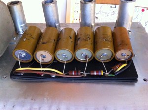 Old bulgy, leakey Mallory caps in the power supply needed to go. They are original and are still kinda working after about 45 years! The 4th from the left is visibly oozing it's electrolyte (an ionic conducting liquid)! Looking from left to right you can see the 4th and 5th cap have 235-7018A and 235-7015A (it looks like) printed on the paper covering, indicating they were manufactured during the 15th and 18th weeks of 1970.