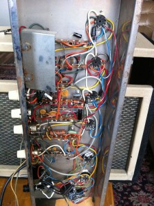 A capacitor in the power supply was disconnected, so the circuit was open, so the amp would not turn on. Aged electrolytics were replaced, old weak or noisy tubes were replaced and after biasing it sounded nice. Tremolo was great, reverb did not work and unfortunately was left unrepaired. The cardboard reverb tank is glued to the chassis and it was crumbling when I tried to remove it. No circuit board in this beast. All components are mounted to terminal strips, tube sockets and potentiometers.