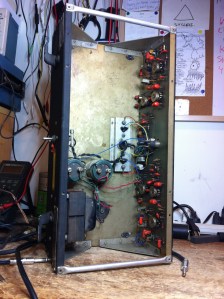 Chassis is kind of funny because it's almost empty. This amp is very light. The only thing that weighs anything is the power transformer. Two big caps for the power supply, and a single PCB mounted on the front panel which holds all the components for the preamps for both channels. Output transistors are mounted on the heatsink bolted to the bottom of the chassis -- as with most 60s and 70s solid state amps it seems they are 2N3055's.