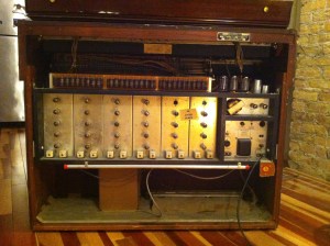 With the back panel in the normal upright position. It has 28 12FQ8s in the tone generator circuit. Above are dozens of brown .22uF/4000V coupling capacitors for all the tubes. According to Bogus Magnus 