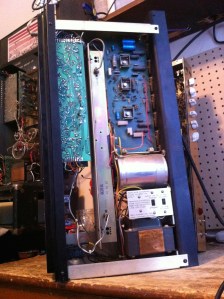 470 circuitry is braced between metal brackets on front, back and sides, so the whole top and bottom of the PCB panels is accessible. Makes it kind of easy to work on, until you have to access the component side of the preamp boards. Anyway, word of warning to 470 owners -- the huge power supply cap mounted to the back panel chassis is centimeters away from the reverb tank, which is at ground potential. Acoustic placed a piece of foam on the reverb tank here so the cap doesn't short to ground, but that was like 40 years ago and the foam is probably dust, like it was in this 470. If the amp gets really shaken up or the cap becomes loose in the bracket it will eventually make contact and short. Sparks will fly. Bad stuff may happen. Put some electrical tape or something on the reverb tank to isolate it just in case. Also make sure you drain the cap of any remaining voltage before doing this so you don't possibly die.