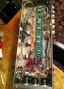 This amp had a bias problem. It is not uncommon for push-pull amps to run one side of the output section harder than the other when pushed into clipping but it seemed excessive in this case since 2 of 4 red JJ EL34 labels were blackened. The phase inverter plate load resistors were reversed. This normally doesn’t matter but in this case it seemed to. Maybe because the coupling caps feeding the two grids of the phase inverter are different values?? Bias was more even when reversing the PI plate load resistors and matching the schematic. It also oscillated at 20K when the master volume was up past 7, and had no grid resistor for V1 so there was lots of radio being picked up by the amp. Adjusting the lead dress of V1, especially the wires coming from the plate leads, rid the 20K oscillation. A grid resistor at pin 2 of V1 got rid of the radio. In the case of no grid stopper to buffer the signal, the wire from V1 to input jack, your guitar cable, and the guitar itself are acting as an antennae.