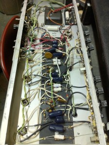 Chassis image and amp is all original and still works, just needs new power tubes. Recap could be nice for possible reliability but customer decided to let the good times roll. The trimpot more easily visible is a balance adjust to balance current draw for the two power tubes. A bias trimpot was installed right next to it to dial in the new tubes. The 470 ohm screen grid resistors measured about 510 ohms and 890 ohms and were replaced. No longer original oh well. At least it works better now. 