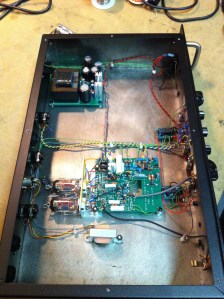 Basically just a little tube preamp with two 12AX7s. You can see the little power supply for them in the top left corner.  I believe these never went into full production because they made it into a pedal instead.  Sorry but no schematic for this one. If you have one please share. 