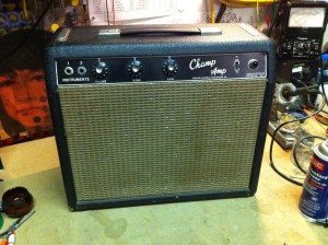 Old blackface Fender Champ. This amp is basically all original and still works good. A 3-prong was added somewhere along the way and the