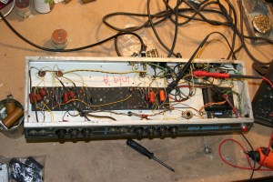 Big chassis with not much in it. Measuring bias with the transformer shunt method. Doing it up with a recap so it will be reliable for an active musician. Power tubes are 70s RCA 6L6GC and they perform just as well as new power tubes.